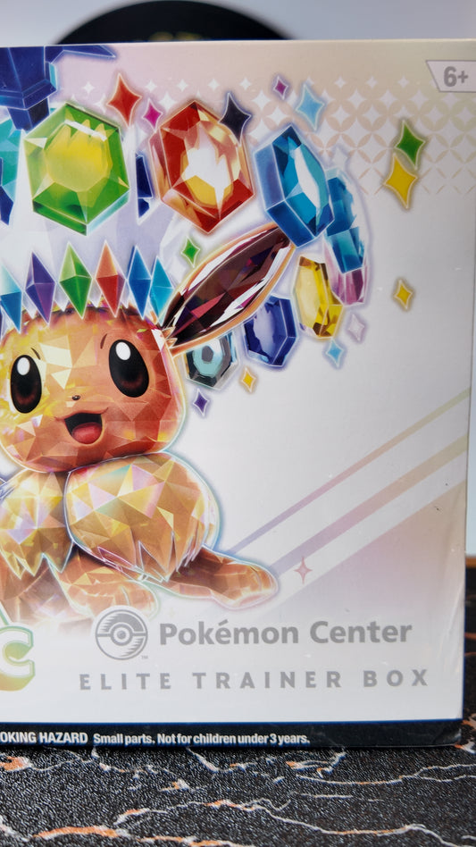 ETB Prismatic Evolutions , Pokémon Center.(Única unidad)